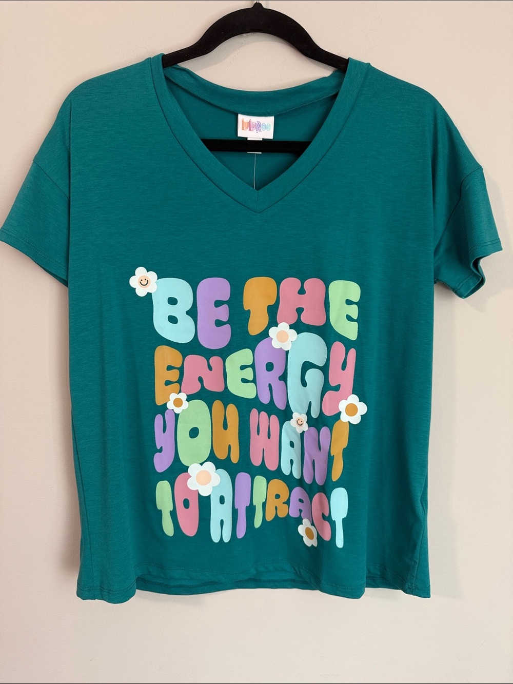 LuLaRoe Teal V-Neck Short Sleeve Tee with Multicolor Groovy Lettering